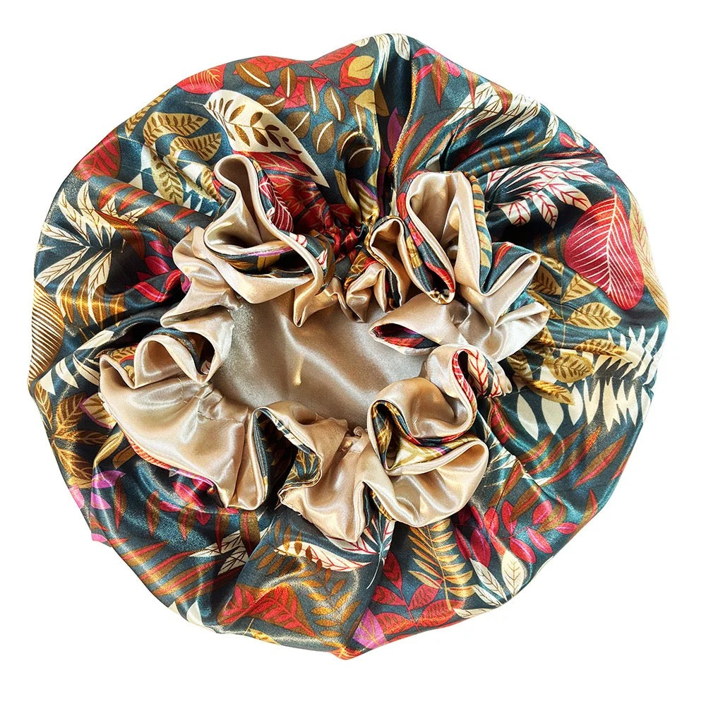 A multicolored floral sleeping hair cap with a satin lining.
